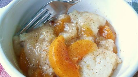 Flour dumplings are added to a peach-infused syrup to create this wonderful, quick-and-easy recipe for Amish peach dumplings. Country Peach Dumplings, Peach Dumplings Recipe, Peach Dumplings With Canned Peaches, Peach Cobbler Dumplings, Authentic Amish Recipes, Peaches And Dumplings, Amish Recipes Authentic Pennsylvania, Amish Deserts, Amish Recipes Authentic