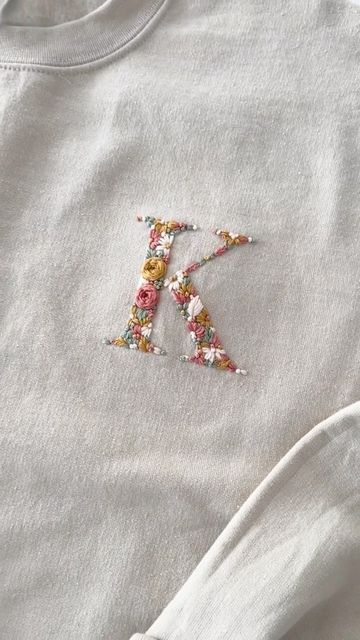 Embroidery Initials Letters On Clothes, Initial Embroidery Letters, Embroidery Initials Letters, Embroidered Baby Clothes, Embroidery Letters, Fancy Dresses Long, Embroidery Stitches Tutorial, Embroidery Shop, Creative Embroidery