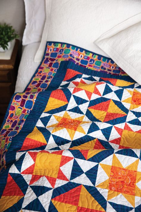 For those cloudy days, here’s a ray of sunshine. The Solaris quilt pattern adds a burst of sunny red and orange color. Complete with plenty of star blocks, you’ll fall in love with this sunny, summery quilt. Designer: Abigail Dolinger Finished size: 61” x 73” Originally published: McCall's Quilting July/August 2020 Skill: Intermediate Orange And Blue Quilt Ideas, Blue Quilt Patterns, Mccalls Quilting, Girl Quilts Patterns, Dear Jane Quilt, Quilt Pattern Book, Orange Quilt, Heart Quilt Pattern, Bed Art