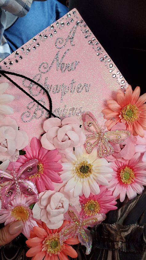 Pink butterflies and flowers grad cap. A new chapter begins ✨️ On To The Next Chapter Graduation Cap, Next Chapter Graduation Cap, Graduation Cap Designs Pink, Pink Graduation Cap Designs, Pink Grad Cap Ideas, Butterfly Grad Cap, Flowers Grad Cap, Flower Grad Cap, Pink Grad Cap