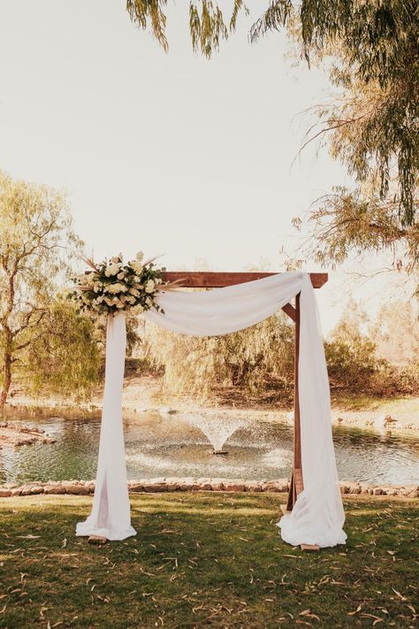 Wedding Arch Homemade, Floral Arch Wedding Outdoor Simple, White Wedding Arch Decor, Waterfront Wedding Ceremony Arch, White Fabric Wedding Arch, Wedding Ceremony Archway, Arch Decoration Wedding Simple, Square Wedding Arch Decor, 2023 Wedding Arch