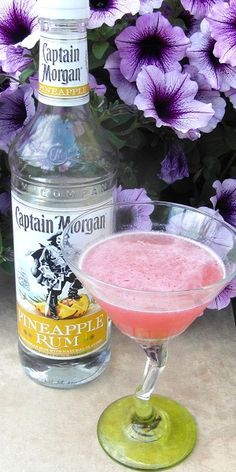 Jump the Shark 1 oz Captain Morgan Pineapple Rum 1 oz Captain Morgan Coconut Rum 1 oz Triple Sec 1 oz lime juice 1 oz Cranberry juice orange peel Shake all the ingredients over ice Strain into a co… Pineapple Rum Drinks, Malibu Rum Drinks, Amazing Drinks, Rum Punch Recipes, Mixed Drinks Alcohol, Pineapple Rum, Captain Morgan, Rum Drinks, Coconut Rum