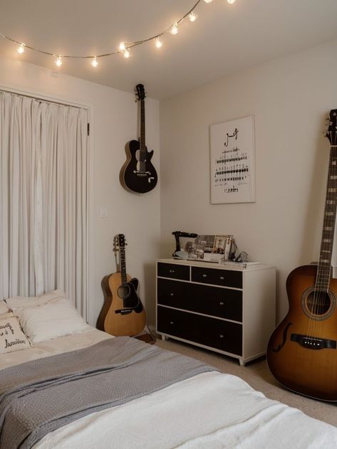 Create a music-themed bedroom aesthetic using a vinyl record as a unique wall art piece and a guitar as a decorative element. Hang string lights to create a whimsical vibe, and incorporate musical notes or lyrics as decals on the walls. Bedroom Music Studio Aesthetic, Music Lover Bedroom, Artist Bedroom Aesthetic, Bedroom Music Studio, Couples Room, Music Themed Bedroom, Music Bedroom, Artist Bedroom, Music Room Decor