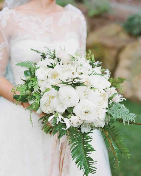 Peony Wedding Bouquets | Martha Stewart Weddings - Peonies, camellias, ranunculus, nerines, and crispa tulips surrounded by maidenhair and umbrella ferns made up this classic white wedding bouquet by Mindy Rice. Bridal Flower Arrangements, Ranunculus Wedding Bouquet, Bouquet Pastel, White Peonies Bouquet, Winter Bridal Bouquets, Anemone Bouquet, Peony Bouquet Wedding, Cascading Wedding Bouquets, Winter Wedding Bouquet