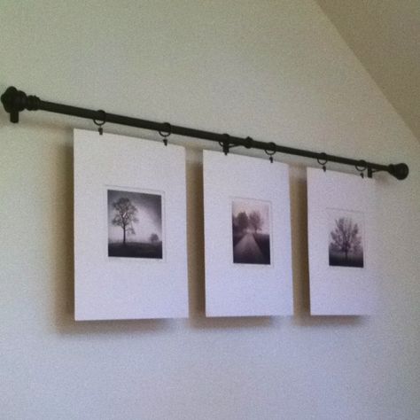 Hang pictures from a curtain rod with curtain hooks, would have been cool to hang them at different levels with twine as well Pictures On Wall, Easy Diy Wall Hanging, Chicken Houses, Hang Pictures, Barn Plans, Outdoor Sheds, How To Hang, Wall Hanging Diy, Garage Plans