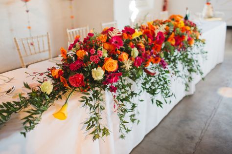 Colorful Wedding Flowers Summer, Colourful Wedding Flowers Table, Bright Coloured Wedding Decor, Head Table Flowers, Bright Wedding Centrepiece, Bright Wedding Flowers Arbour, Bright Red Flowers, Colourful Wedding Marquee Decoration, Wedding Top Table Flowers