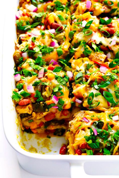 LOVE this Verde Chicken Enchilada Casserole recipe! It's made with your favorite enchilada fillings (chicken, cheese, veggies, beans, corn tortillas). It's tossed with the best homemade green enchilada sauce. It's naturally gluten-free, and easy to customize. And it's absolutely DELICIOUS. The perfect Mexican casserole dinner that's also easy to freeze, and makes great leftovers for meal prep. | Gimme Some Oven #mexican #chicken #casserole #enchilada #glutenfree #dinner #mealprep #cheesy Best Chicken Casserole, Panini Recipes Chicken, Chicken Enchilada Casserole Recipe, Vietnamese Style, Verde Chicken, Recipes With Enchilada Sauce, Chicken Tikka Masala Recipes, Enchilada Casserole Recipes, Chicken Enchilada Casserole