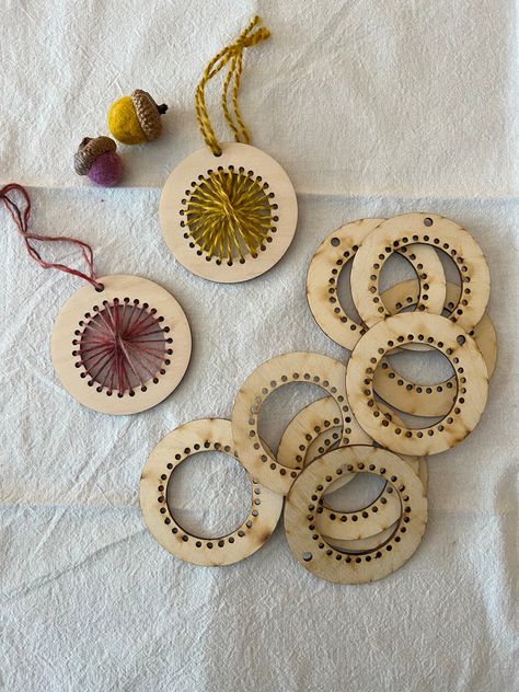 These adorable loom ornament blanks will add some weaving inspired flair to your holiday tree! These little looms make a great handmade gift, and there are so many different ways you can use them. The holes in each ornament are left unstitched so you can weave, crochet or stitch them in with a needle or hook and yarn or embroidery floss. The possibilities for how to adorn these are limitless. Pair them with our Rustic Wool Threads, or display a bit of your favorite handspun! Sold individually. P Woven Ornaments, Montessori Sewing, Wood Weaving, Embroidery On Wood, Yarn Ornaments, Wood Laser Ideas, Wood Embroidery, Crocheted Cardigan, Wood Jewelery