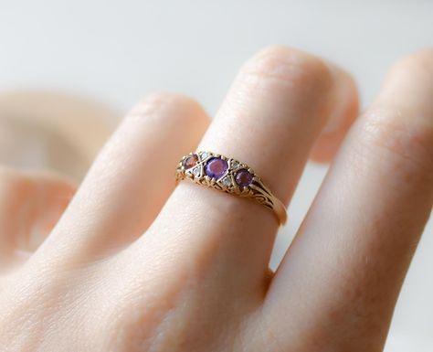 ✨ New Arrival! ✨ Add a touch of classic elegance to your collection with this exquisite 9ct gold amethyst and diamond ring. 💍 Crafted in 1988, it features three vibrant amethyst stones, sparkling with small diamond accents. Weighing 2.2 grams and sized UK P 1/2 (US 7.75, EU 56), this ring boasts a timeless design perfect for any occasion. #VintageJewelry #AmethystRing #GoldJewelry #ClassicElegance #MyGoldenFinds Grad Rings College, Grad Rings, Amethyst And Diamond Ring, Amethyst Stones, Amethyst Stone, Amethyst Ring, Classic Elegance, New Arrival, Timeless Design