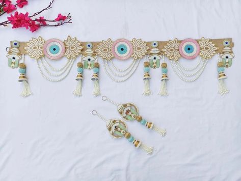 Trending Evil eye Bandhanwar with hamsa hand 🪬 on Jute base ✨✨ Bandhanwar with shubh labh DM us for more details or WhatsApp us on 9867422790 Trousseau Packing, Hanging Flower Wall, Evil Eyes, Diwali Decorations, Hamsa Hand, Flower Wall, Evil Eye, Wall, Quick Saves