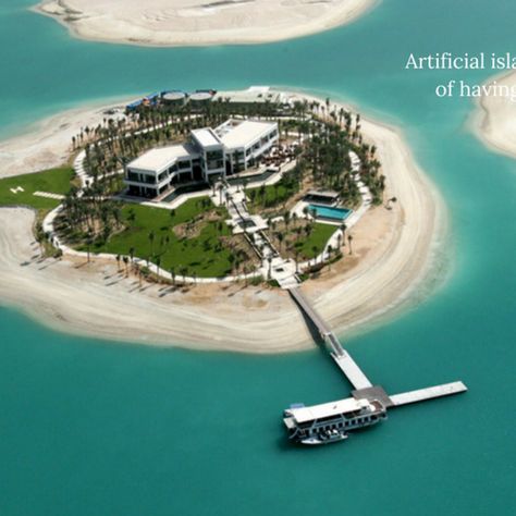 Artificial Island Facts FUN AND FASCINATING ARTIFICIAL ISLAND FACTS ARTIFICIAL ISLANDS ARE NOT CONSIDERED ISLANDS FOR PURPOSES OF HAVING THEIR OWN TERRITORIAL WATERS OR EXCLUSIVE ECONOMIC ZONE. MORE THAN 94 MILLION CUBIC METERS OF SAND AND 5.5 MILLION CUBIC METERS OF ROCK WAS USED TO CREATE THE PALM ISLANDS OF DUBAI. People Facts, Building Front Designs, Artificial Island, Palm Island, Building Front, Amazing Places On Earth, The Palm, Amazing Places, City Skyline