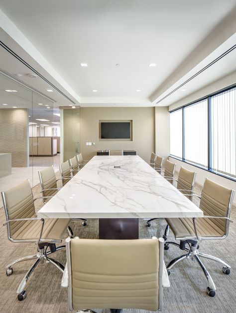 Neolith Calacatta Conference Table paired with Eames Management Chairs. | OllinStone.com 714-535-0800 Eames Management Chair, Conference Table Design, Conference Room Design, Meeting Room Design, Office Meeting Room, Corporate Office Design, Office Remodel, Office Renovation, Modern Office Design