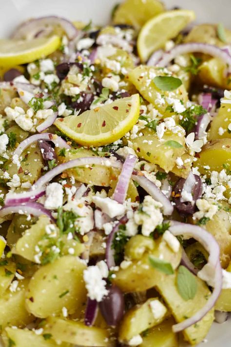 Fresh herbs, savory olives, and creamy feta combine to create this zippy Lemon Greek Potatoes Recipe! Serve it for a crowd-pleasing side dish that couldn't be easier to make. Lemon Greek Potatoes, Greek Potatoes Recipe, Greek Potato Salad, Greek Side Dishes, Greek Roasted Potatoes, Feta Dressing, Greek Lemon Potatoes, Greek Potatoes, Roasted Potato Recipes