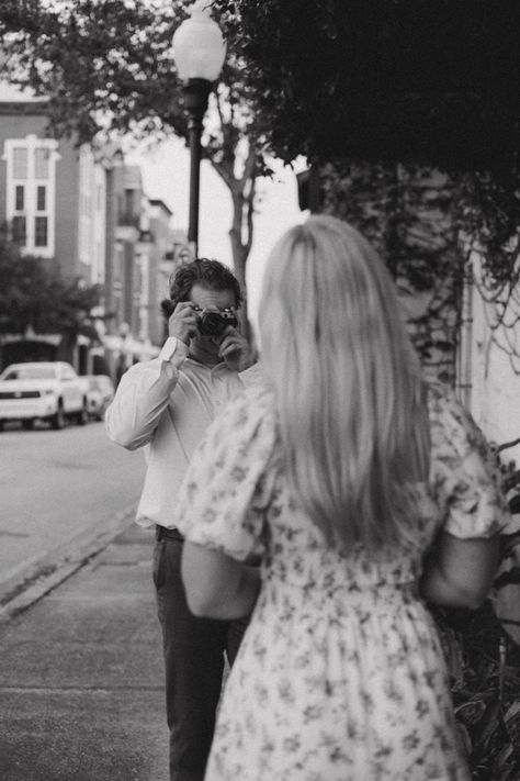 Fiancé takes picture of future bride on film camera in downtown Orlando Couple Taking Photo With Camera, Camera Prop Photoshoot, Couple Photoshoot Film Camera, Camera Couple Aesthetic, Couple With Camera, Launch Post, Media Coursework, Engagement Board, Boyfriend Type