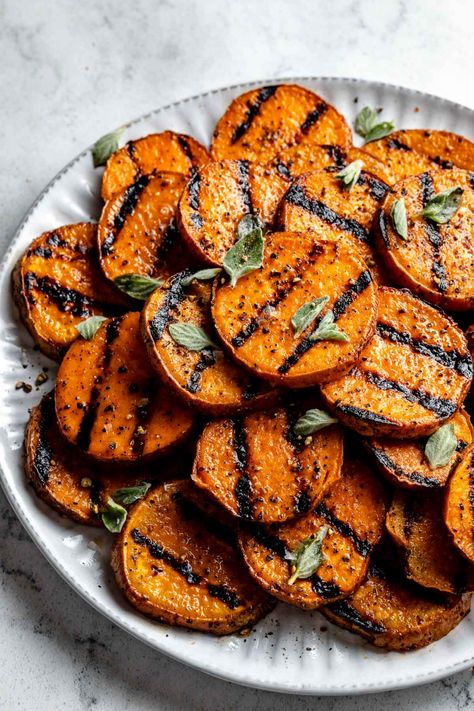 These Perfectly Grilled Sweet Potatoes will change how you think about this humble root vegetable! Smoky grilled sweet potatoes have a caramelly charred crust & sweet & creamy inside that’s pure perfection. Enjoy them as a summer side with BBQ chicken, ribs, & burgers, or toss grilled sweet potatoes into your favorite grain bowls, tacos, & salads. Ready in 10 minutes with 3 ingredients. Naturally vegetarian, vegan, dairy, & gluten-free. #grilledsweetpotatoes #grilledvegetables #sweetpotatorecipe Grilled Sweet Potato Recipes, Grilled Veggies Recipes, Best Grilled Vegetables, Easy Bbq Side Dishes, Potatoes Easy, Grilled Sweet Potatoes, Sweet Potato Skins, Sweet Potato Slices, Sweet Potato Wedges