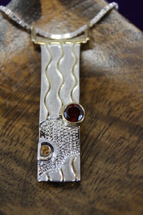 Solid sterling silver with 18k vermeil gold accent plate signed designer juvite rectangle shaped textured pendant set with one .86 ct. round genuine garnet; and one 6.5 mm .96 ct. round genuine citrine. piece measures 2 1/8 x 5/8 inch and hanging on a 20 inch sterling silver box chain.  16.8 grams. mp210048 Metal Smithing, Soldering Jewelry, Precious Metal Clay, Top Ideas, Sapphire Pendant, Silver Work, Silver Box, Metal Clay, Gold Accent