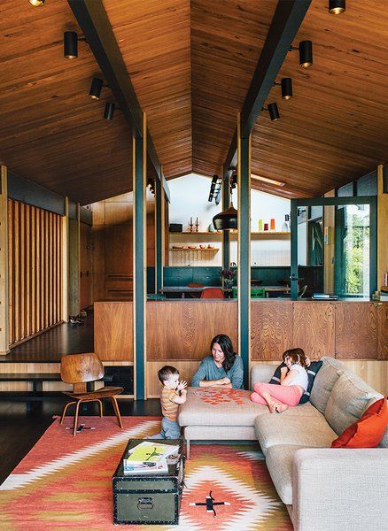 Dwell - Midcentury Renovation in Portland Capitalizes on Nature with Seven Doors to the Outside Midcentury Modern Paint Colors, Modern Paint Colors, Living Colors, 1950s House, Hardwood Floors Dark, Mid Century Modern Interiors, Living Room Lighting, Diy Inspiration, Wood Paneling