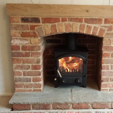 Brick Fireplace with Oak Mantle and stone hearth Fireplace With Oak Mantle, Brick Fireplace Hearth, Exposed Brick Fireplaces, Wood Burner Fireplace, Wood Burning Stoves Living Room, Log Burner Living Room, Oak Mantle, Wood Burning Fireplace Inserts, Stone Hearth