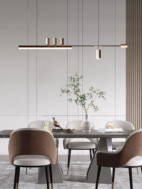 La suspension Linear Elegance présente un design raffiné et minimaliste parfait pour les espaces contemporains. Sa fine barre horizontale, fabriquée à partir de métal de haute qualité avec une finition élégante, supporte plusieurs luminaires cylindriques qui dégagent une lumière ambiante douce. Ce luminaire est conçu pour offrir à la fois un éclairage fonctionnel et une touche de sophistication moderne, ce qui le rend idéal pour être placé au-dessus des salles à manger, des îlots de cuisine ou d Dinning Room Lamp, Small Dining Area Design, Minimalist Dining Light, Minimalist Dining Area, Dining Minimalist, Modern Dining Room Light Fixtures, Modern Luxury Dining Room, Dining Lights, Dining Lamp