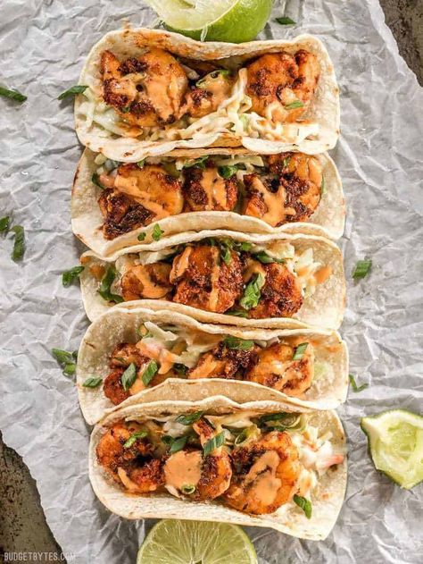 Smoky and spicy shrimp, sweet and tangy slaw, and a zesty garlic lime sauce make these Blackened Shrimp Tacos seriously delicious! Taco Shrimp, Blackened Shrimp Tacos, Tangy Slaw, Grilled Shrimp Tacos, Shrimp Tacos Easy, Spicy Shrimp Tacos, Cilantro Lime Slaw, Shrimp Taco Recipes, Blackened Shrimp