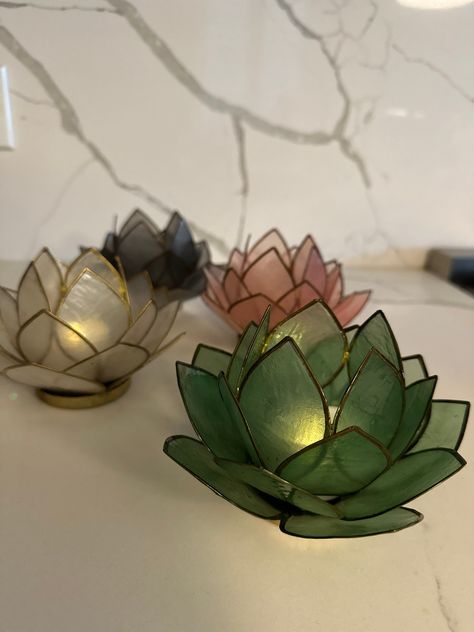 Handcrafted capiz shells are a distinctive, translucent material that adds a beautiful, natural touch to home decor. Emphasize the unique appearance and texture of the capiz shells.  The lotus flower is a symbol of purity, enlightenment, and rebirth in many cultures, this candle holder can enhance different decor styles, from bohemian to modern. Lotus Flower Candle Holder, Lotus Flower Candle, Shell Candle Holder, Lotus Flower Design, Shell Candles, Flower Candle Holder, Tealight Candle Holder, Capiz Shell, Tealight Candle