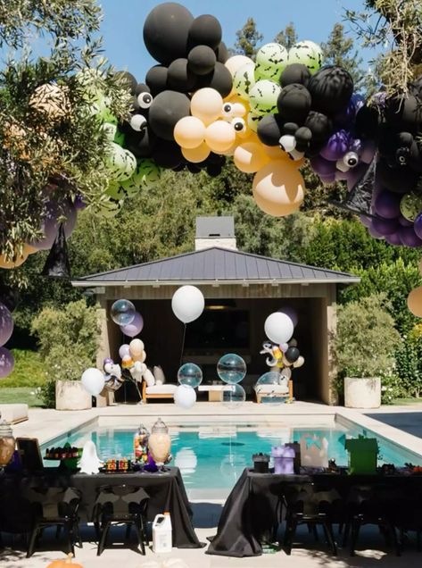 Khloé Kardashian's Halloween Party Decorations: Photos Kardashian Halloween, Floating Witch Hats, Floating Witch, Pumpkin Decorating Party, Khloe And Kourtney, Kim Khloe Kourtney, Simple Captions, Candy Wall, Cow Costume