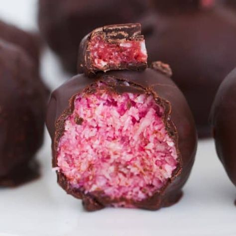 A half-eaten Cherry Ripe Ball covered in dark chocolate. Cherry Ripe Recipes, Coconut Sweetened Condensed Milk, Apple Zucchini, Zucchini Carrot, Carrot Bread, Cherry Coconut, Pink Food, Glace Cherries, Cherry Recipes