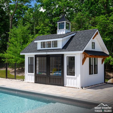 Today, sheds have more uses than just storage. This customer converted a 12' x 16' Modern Farmhouse Carriage House into a pool house. This shed has Board and Batten Siding, a transom dormer, timber frame accents, and a cupola. . #tby73687 #thebarnyard #thebarnyardstore #worldsbestsheds #barnyardsheds #modernfarmhouse #carriagehouse #farmhouse #modernfarmhousecarriagehouse #shed #pool #poolhouse #shedgoals #timberframeaccents Metal Roof Pool House, Storage Building Pool House, Shed And Pool House Combo, Storage Shed Pool House, A Frame Pool House, Board And Batten Pool House, Tiny Pool House With Bathroom, Big Shed Ideas, Shed To Pool House Conversion