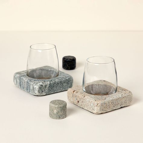 Dry, full-bodied, oaky, or sweet, some grape varieties are best when served chilled. Before watering down wine with ice, we suggest a rock-solid alternative. Made from reclaimed granite countertops, these coasters provide an ingenious cooling effect, especially when used with the chunky granite stones. Keep the set in the freezer to lock in their temperature-maintaining magic. Place the cold stones in the included stemless glasses and then fill with pre-chilled wine. The sturdy coasters have pre Spilled Wine, Granite Colors, Uncommon Goods, Marble Coasters, Granite Stone, Coaster Design, Stemless Wine Glasses, Wine Chiller, Year Anniversary Gifts