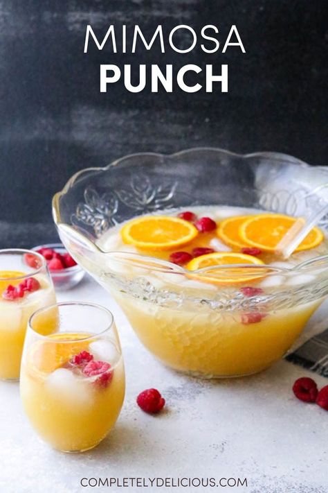 This big batch of mimosas served in a punch bowl is perfect for a brunch party! | how to make the perfect mimosa | mimosa punch for a crowd | mimosa punch recipe | mimosa punch bowl | mimosa punch recipe brunch | brunch drink recipes | brunch mimosa ideas | brunch mimosa recipes | mimosas for a crowd | mimosas for a group | brunch and mimosa party | brunch party drinks | brunch party drink ideas | large batch mimosa recipe | large batch of mimosas Mimosa Themed Party, Make Ahead Mimosa Recipe, Champagne Brunch Birthday Ideas, Brunch Mimosa Ideas, Fun Mimosa Recipe, Mimosa Birthday Party Ideas, Brunch Drink Ideas Non Alcoholic, Mimosa Punch For A Crowd, Mimosa Punch Recipe