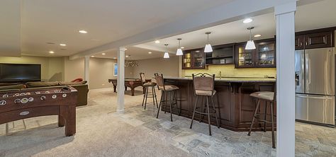 Top Trends in Basement Design - Sebring Services Basement Wet Bar Ideas, Transitional Basement, Tv Over Fireplace, Remodeling Trends, Slate Fireplace, Basement Finishing, Bathroom Plans, New Staircase, Small Basements