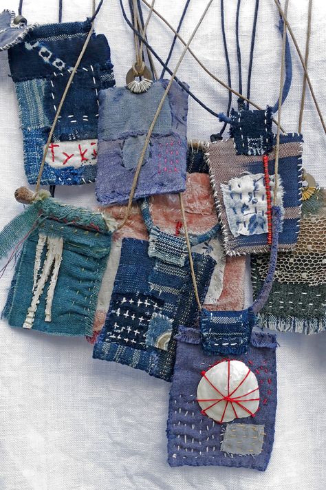 close up of a group of slow stitched necklaces worn with a white smock Ann Wood, Fiber Art Jewelry, Fiber Jewelry, Textile Fiber Art, Fabric Necklace, Hand Dyed Fabric, Textile Jewelry, Fabric Beads, Antique Textiles