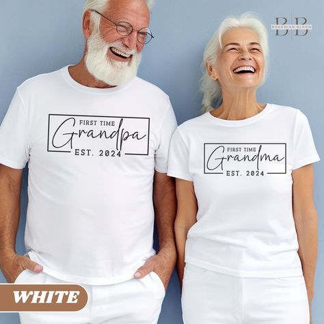 Celebrate the grandest announcement in style with our Custom Est Grandma and Grandpa Shirt, a whimsical and heartwarming gift for the newest members of the grandparent club, ensuring they wear their excitement proudly and fashionably!  Repeat Grandparents Listing: https://bohemianbloomdesigns.etsy.com/listing/1681128711 Everything You Need to Know: 👕 T-shirt Brand Bella and Canvas | Unisex Adult Sizing ⏳🚚 Production & Shipping All items are made-to-order. They will ship within 1-5 business day Grandma Announcement First Time, Grandparent Shirts, Grandparents Pregnancy Announcement, First Time Grandparents, Pregnancy Announcement To Parents, Grandparents Gifts, Engagement Wishes, Twin Baby Clothes, Grandparents Shirt