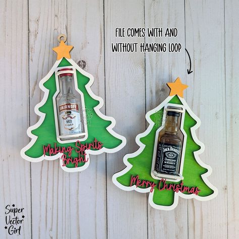 Christmas tree mini bottle holders. Compatible with small round and square bottles (last photo shows all the bottles I have tested and they fit). Enjoy 20% OFF New Release with discount Code: 20OFFNEW File link: https://www.supervectorgirl.com/products/christmas-tree-shooter-holder-svg-laser-cut-file-mini-alcohol-bottle-gift-small-round-or-square-booze-bottle-shot-shooters-alcohol-50-ml-shooters-mini-liquor-holder Happy to answer any questions. Made for 3mm (1/8 inch) thick material. Booze Christmas Tree, Mini Alcohol Bottles Gifts, Mini Alcohol Bottles, Bottle Shoot, Liquor Gifts, Mini Bottle, Captain Morgan, Alcohol Bottles, Candy Holder