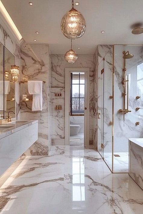 Design a modern glam bathroom with luxurious accents and stylish fixtures. #GlamBathroom #ModernDecor #LuxuryLiving Million Dollar Bathrooms Master Bath, Fancy Showers Walk In, Modern Glam Bathroom Decor, Luxury Bathroom Design Ideas, Elegant Master Bathrooms Luxury, Hollywood Glam Bathroom, Fancy Bathroom Luxury, Luxury Bathroom Ideas Master Suite, Small Glam Bathroom