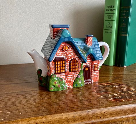 Vintage Thomas Kincade Country Cottage Teapot - Decorative Teapot - Cottagecore Decor - Tea Party House Teapot SIZE: 8 " x 5" x 3.8" Vintage item comes as is, no props or decorative items included.  Item does show wear due to prior love, as shown in pictures.   All of my unique vintage items are a final sale.  No refund, exchange, or credit.  If there are additional questions about any item, feel free to message me! House Teapot, Teapot House Illustration, Cottagecore Tea Set, Fairy House Teapot, Teapot Ceramic Handmade, Cottage Core Teapot, Dream Tea, Pastel Kitchen, Novelty Teapots