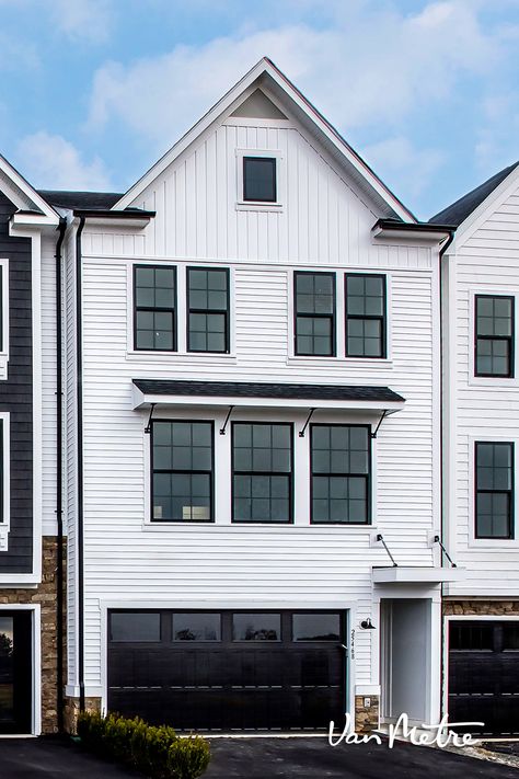 Our townhomes at Prosperity Plains—The Holt & The Carver—combine architecture inspired by Virginia’s homestead history with the technology and modern thinking you expect in a home for today (and tomorrow). The stacked stone, black windows and white siding give the home a farmhouse feel. Condo Design Architecture, Contemporary Townhouse, Townhouse Exterior, White Siding, Contemporary House Exterior, Condo Design, Townhouse Designs, Urban Farmhouse, Narrow House