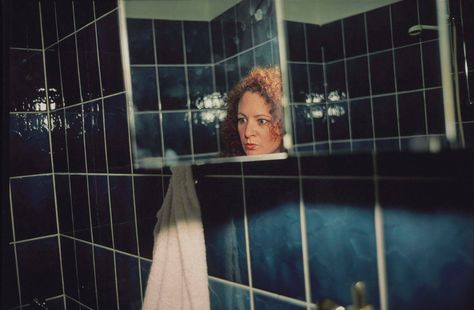 NAN GOLDIN (B. 1953) | Self-Portrait in the Blue Mirror, Berlin | 1990s, Photographs | Christie's Nan Goldin Photography, Nan Goldin, Levitation Photography, A Level Photography, Double Exposure Photography, Digital Museum, Experimental Photography, Exposure Photography, Water Photography