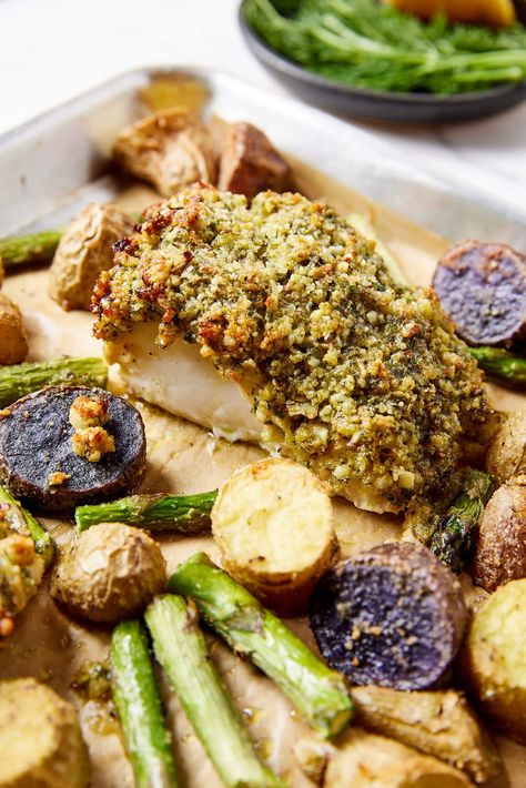 The brightness of spring and summer is brought to life with this herb crusted baked halibut meal all on one sheet pan! A flavorful crust adds depth and texture to the halibut, while roasted potatoes and asparagus provide a delicious accompaniment. Coming together in less than 45 minutes, this meal is a satisfying combo great for any weeknight. Herb Crusted Halibut, Roasted Potatoes And Asparagus, Baked Halibut, Potatoes And Asparagus, Roasted Potatoes, Sheet Pan, Asparagus, Seafood, Herbs