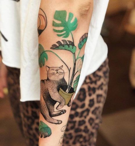 Explore 20 Lush Tropical Leaves Tattoo Ideas - Perfect for Nature Lovers in 2024 Cat And Monstera Tattoo, Plant Cat Tattoo, Plant Tatoos, Monstera Deliciosa Tattoo, Tropical Leaves Tattoo, Houseplant Tattoo, House Plant Tattoo, Monstera Tattoo, Tropical Tattoo