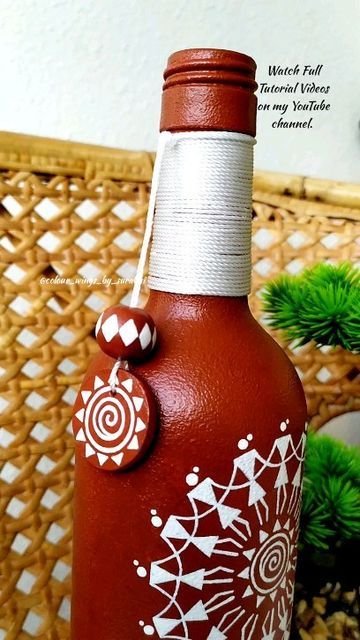 Surabhi Roy on Instagram Warli Bottle Painting, Warli Bottle Art, Beer Bottle Crafts Decoration, Beer Bottle Art Creative, Glass Bottles Painting, Painting Objects, Diy Resin Wall Art, Bottle Paintings, Beer Bottle Art