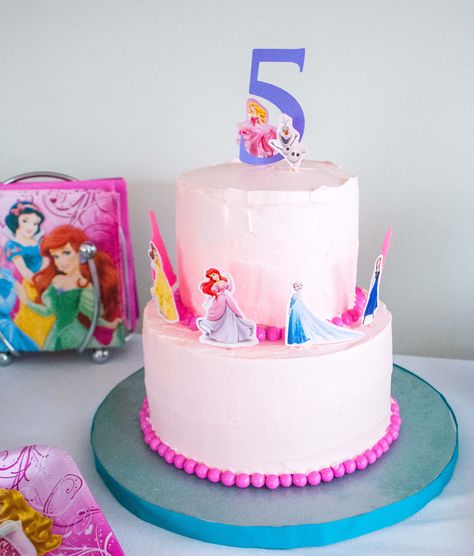 Want to make an easy DIY princess birthday cake? Use princess stickers! Call it a cop-out or a moment of pure genius, using princess stickers is hands-down the easiest way to decorate a DIY Disney princess birthday cake …and really any other character cake too. Elise wanted an “All The Disney Princesses” birthday cake including Elsa/Anna/Olaf from Frozen, Rapunzel from Tangled, Ariel from The Little Mermaid, Belle from Beauty and Disney Princess Birthday Cake, Disney Princess Birthday Cakes, Construction Birthday Cake, Princess Cakes, Disney Princess Cake, Diy Birthday Cake, Disney Birthday Cakes, Birthday Cakes For Teens, 5 Birthday