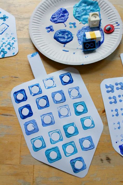 Easy dreidel craft with printable template - NurtureStore Hanukkah Projects For Toddlers, Hanukkah Eyfs Activities, Hannakuh Crafts For Toddlers, Menorah Crafts For Toddlers, Hanukkah Prek Activities, Hannukah Activities Toddlers, Kwanza Crafts Preschool, Chanukah Preschool Activities, Hannukah Crafts Toddlers