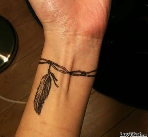 feather on a string wrist tattoo Armband Tattoo Frau, Wrist Tattoos Girls, Band Tattoo Designs, Armband Tattoo Design, Anklet Tattoos, Feather Tattoo Design, Wrist Tattoos For Guys, Arm Band Tattoo, Small Wrist Tattoos