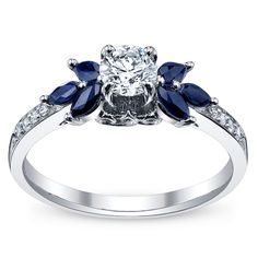 Something like this with diamonds instead of sapphires and an emerald cut center stone. Emerald Ring White Gold, Gold Diamond Engagement Ring, Pretty Ring, White Gold Diamond Engagement Ring, Ring Flower, Black Ring, Sapphire Engagement Ring, Pretty Rings, Sapphire Engagement