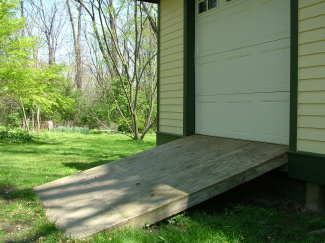 This shed ramp is very close to the maximum slope that allows you to safely drive a riding mower into the shed. PHOTO CREDIT: Brent Walter Shed Ramps For Mower, Yard Water Fountains, Shed Ramp, Garage Organizing, Wire Mesh Fence, Shed Floor, Ranch Ideas, Garage Organize, Riding Mower