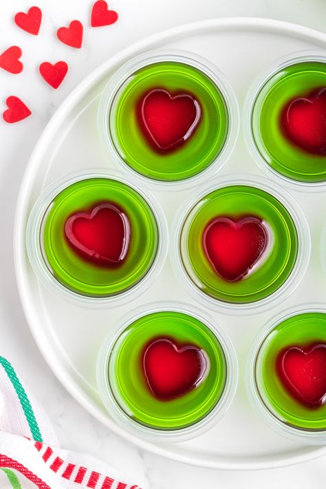 Grinch Jello Shots - Sweet CS Designs. Grinch Jello Shots, Green Jello Shots, Grinch Jello, Christmas Jello Shots, Green Jello, Grinch Heart, Christmas Party Planning, Jello Shot Recipes, Xmas Treats