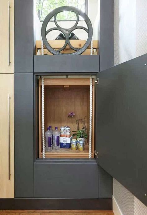 Manual dumbwaiter with large flywheel pulley and rope pulls Grocery Elevator, Laundry Dumbwaiter, Dumbwaiter Diy, Manual Dumbwaiter, Dumbwaiter Design, Diy Dumbwaiter, Laundry Elevator, Dumbwaiter Ideas, Secret Elevator