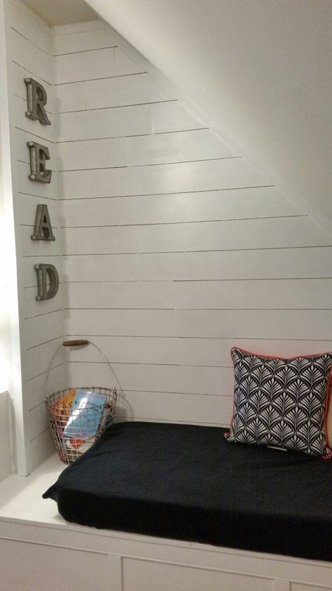 Reading nook with shiplap. Perfect for our awkward,  sloped wall space. Storage Decor Ideas, Ideas Under Stairs, The Space Under The Stairs, Sloped Wall, Bed Under Stairs, Relaxation Corner, Space Under The Stairs, Under Stairs Nook, Stair Nook