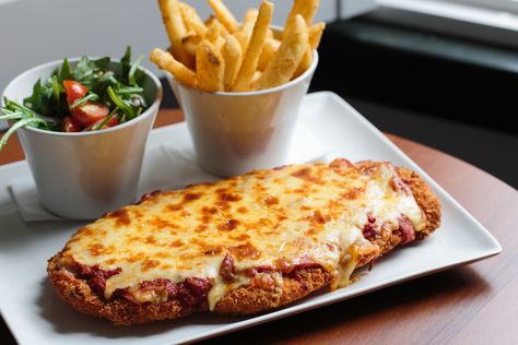 Meet the pubs upholding the proud Australian tradition of the humble chicken parma. Chicken Parma, City Of Melbourne, Pizza Shapes, Good Thursday, Best Italian Restaurants, Tomato Relish, Melbourne City, Winter Comfort Food, Pub Food